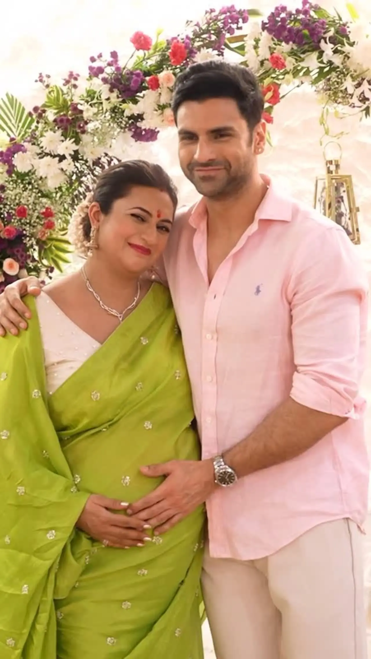 For godh bharai, Divyanka Tripathi embraced festive elegance in a lime green saree paired with a white blouse. Keeping her maternity style graceful and minimal.